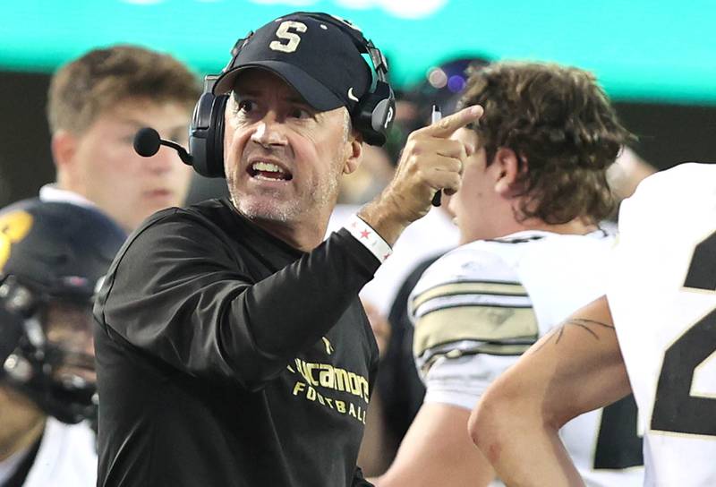 Sycamore's head coach Joe Ryan tells an official where he wants the ball spotted during the First National Challenge against DeKalb Friday, Aug. 26, 2022, in Huskie Stadium at Northern Illinois University in DeKalb.