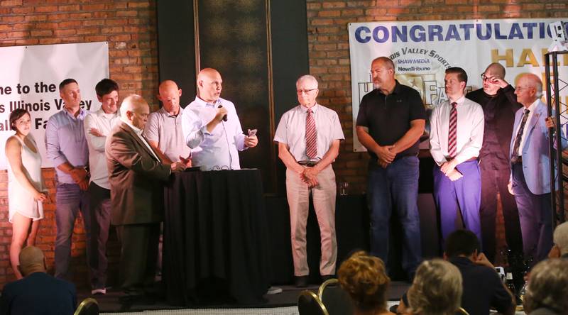 Members of the 1997-98 Hall Boys Basketball Team were recognized during the 2025 Shaw Media Illinois Valley Sports Hall of Fame at the Auditorium Ballroom in La Salle.  The team honored Derek Baird, a member on the team passed away in 2024 from cancer. The Baird family accepted the award in his honor.