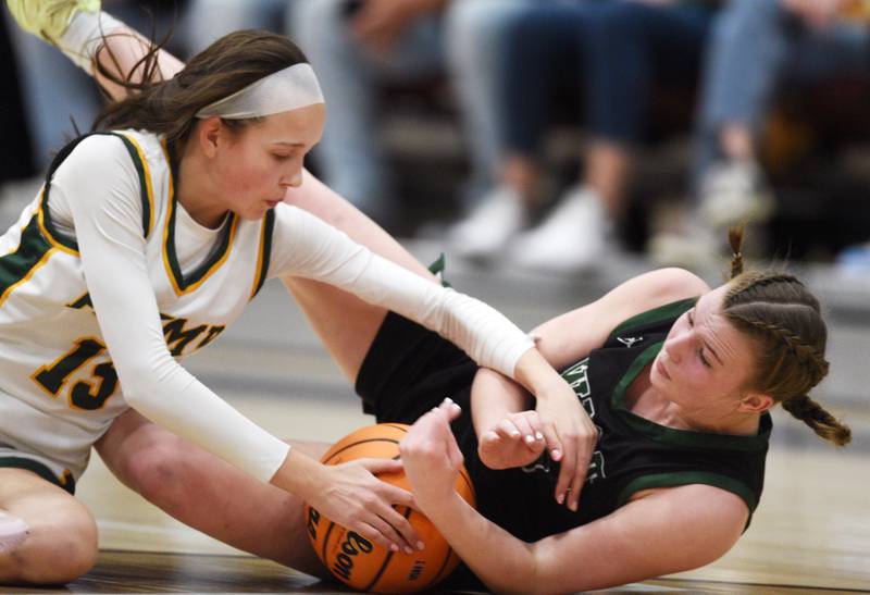 Fremd’s Gracie Todd, left, and Glenbard West's Julia Benjamin go to the floor for a loose ball during the Hersey Class 4A supersectional at Forest View Education Center on Monday, March 3, 2025 in Arlington Heights.