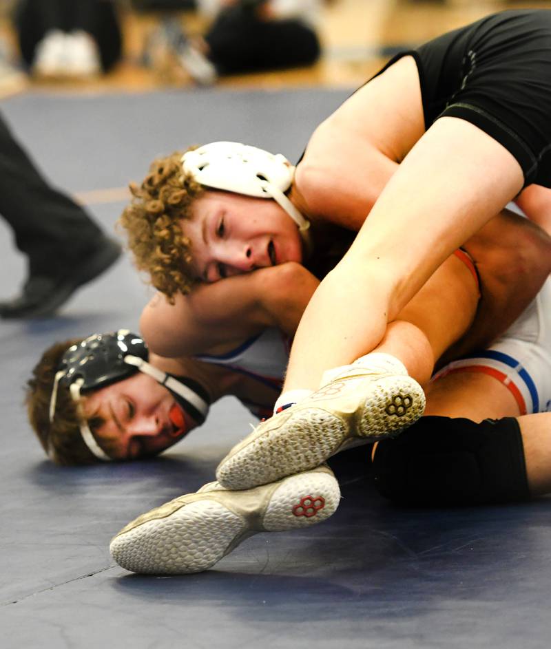 Oregon's Preston LaBay tries to escape a hold by Lena Winslow's Arrison Bauer in the championship place match at 120 pounds at the 1A Polo Wrestling Regional held at Eastland High School on Saturday, Feb. 4.