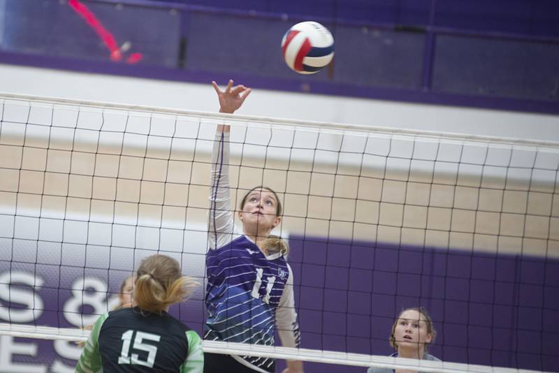 Dixon’s Ella Govig spikes the ball against Alleman on Wednesday, Sept. 7, 2022.