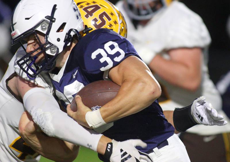 Cary-Grove’s Holden Boone runs the ball against Jacobs in varsity football on Friday, Sept. 20, 2024, at Al Bohrer Field on the campus of Cary-Grove High School in Cary.