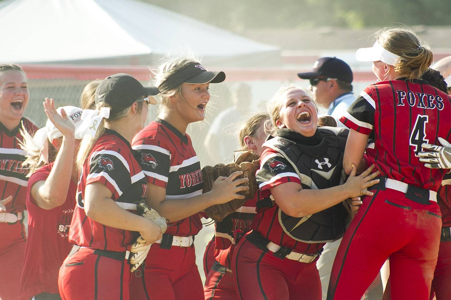 The Yorkville High School varsity softball team celebrates after defeating Neuqua Valley High School in the IHSA Class 4A Sectional match June 10 against Neuqua Valley High School.