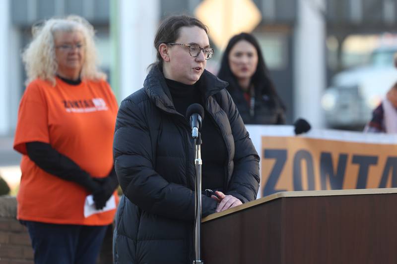 Jessica Beezhold, representative for Lauren Underwood, speaks during a rally for ZONTA Says No To Violence Against Women outside the old court house on Tuesday in Joliet.