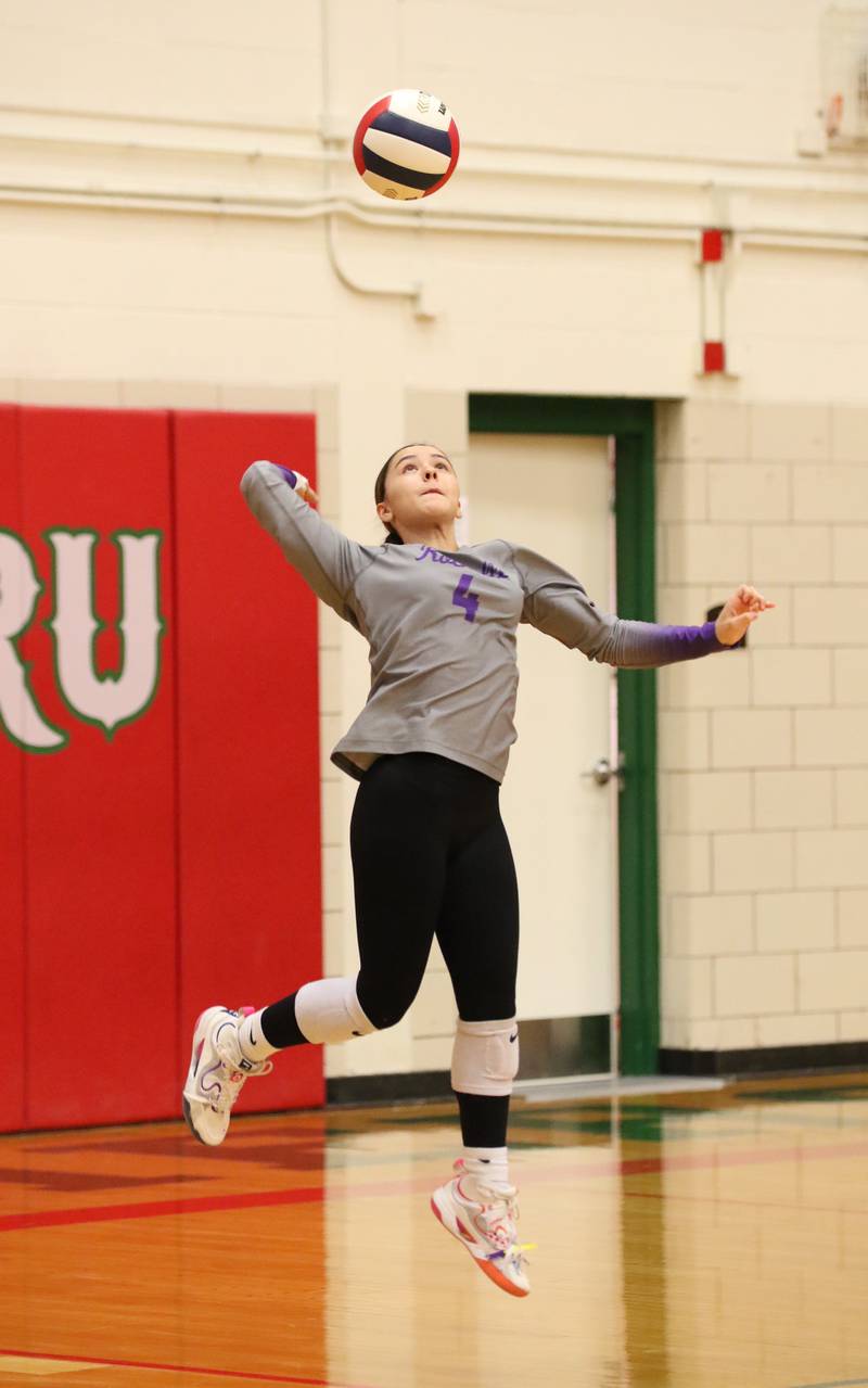 Rochelle's Ella Thompson serves the ball during the Hubs' match with La Salle-Peru.
