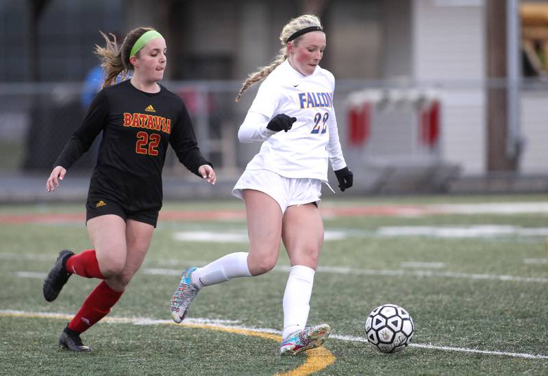 Batavia’s Ryan Gianfrancesco (left) and Wheaton North’s Rowan Smith go after the ball during a game at Batavia on Thursday, April 7, 2022.