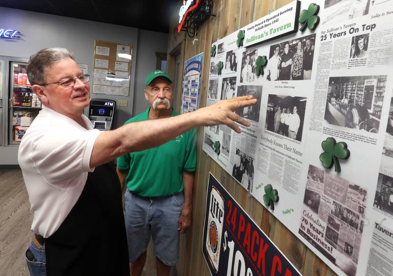Earl (left) and Greg Sullivan, who own Sullivan's Tavern with brother Albert and sister-in-law Cindy, (not pictured) talk about some of the history of the location Thursday, May 15, 2025, at the tavern in DeKalb. The bar is celebrating 80 years in business with an event Saturday, May 17, that will include food and live entertainment.