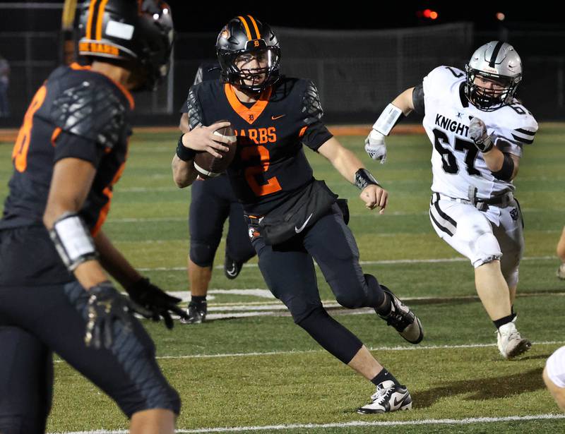 DeKalb's Cole Latimer scrambles away from Kaneland's Garrett Herst during their game Friday, Sept. 12, 2025, at DeKalb High School.