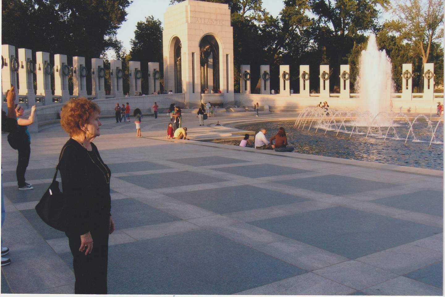 Marie Pometto Chase looks on while visiting the World War II Memorial in Washington, D.C.
