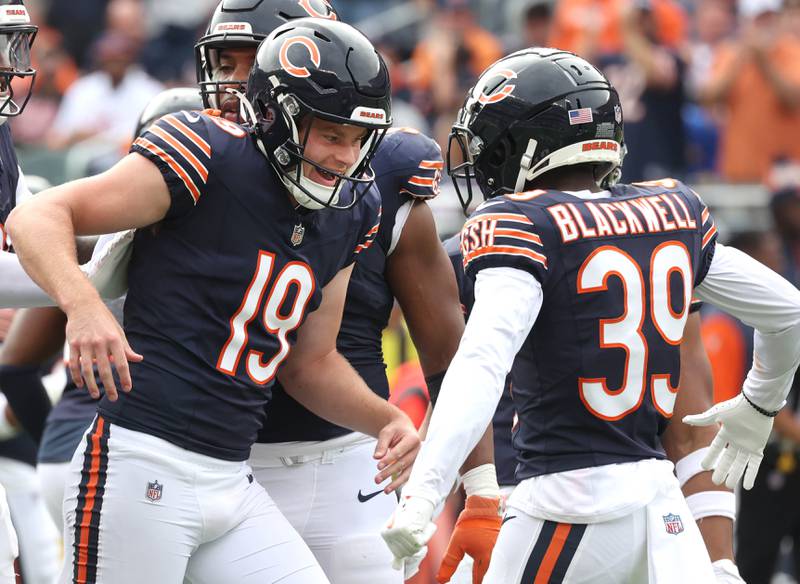 Chicago Bears cornerback Josh Blackwell (right) congratulates Bears punter Tory Taylor after his 66 yard punt pinned the Los Angeles Rams at their own 8-yard line during their game Sunday, Sept. 29, 2024, at Soldier Field in Chicago.