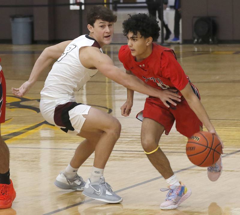 Prairie Ridge's Joseph Vanderwiel tries to steal the ball from South Elgin’s Shailen Patel during a Hinkle Holiday Classic basketball game Tuesday, Dec. 27, 2022, at Jacobs High School in Algonquin.
