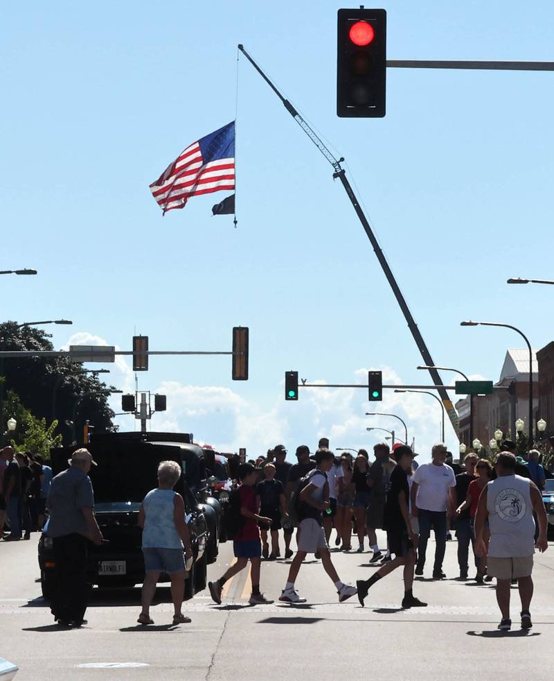 Visitors check out the cars on State Street in Sycamore Sunday, July 31, 2022, during the 22nd Annual Fizz Ehrler Memorial Car Show.