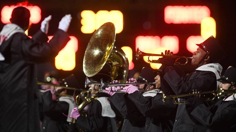 The Schaumburg High School marching band plays the national anthem before a football game with Palatine in Schaumburg on Friday, October 14, 2022.