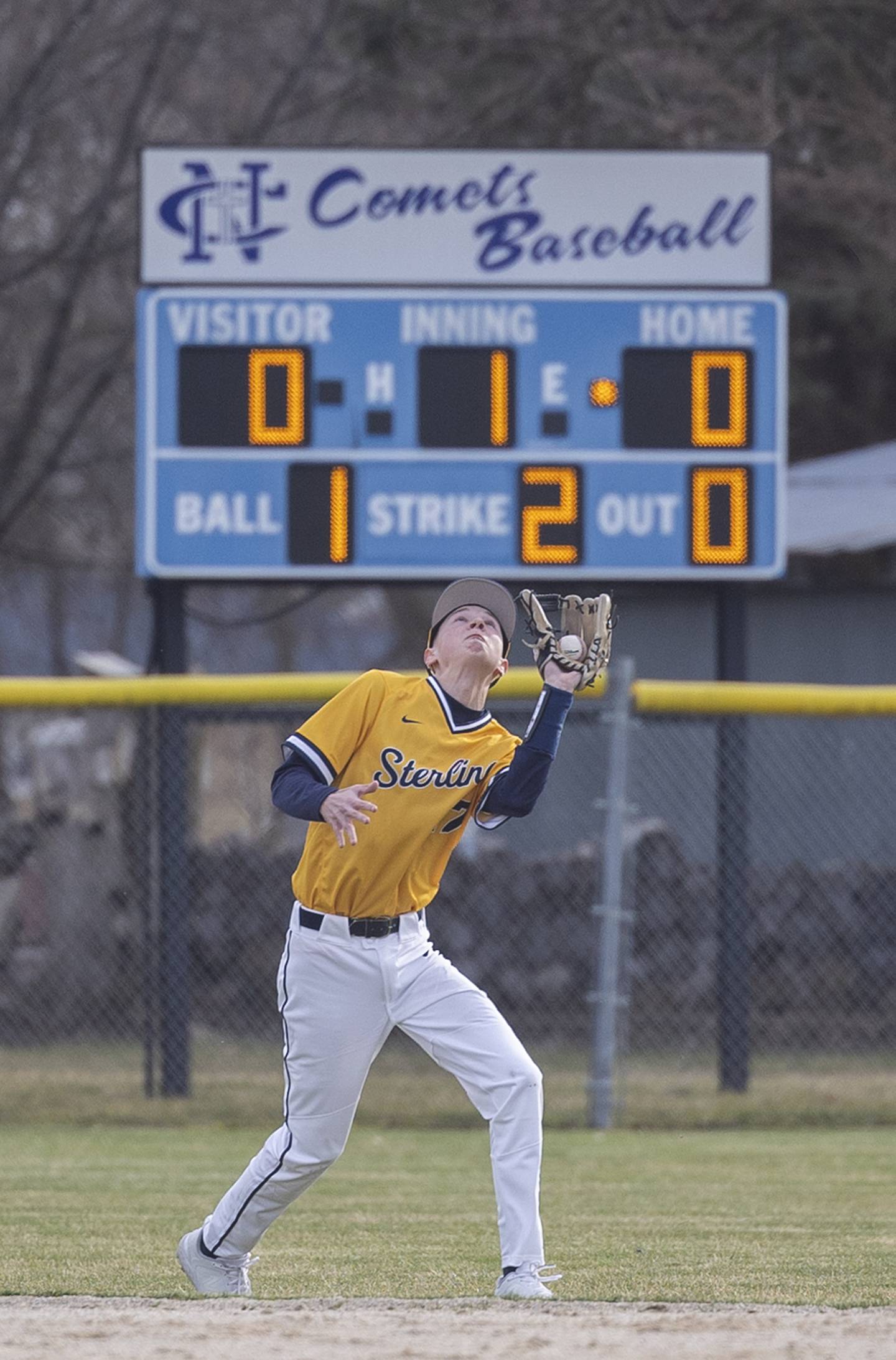 Sterling’s Bryce Hartman hauls in a pop fly against Newman Tuesday, March 12, 2024.