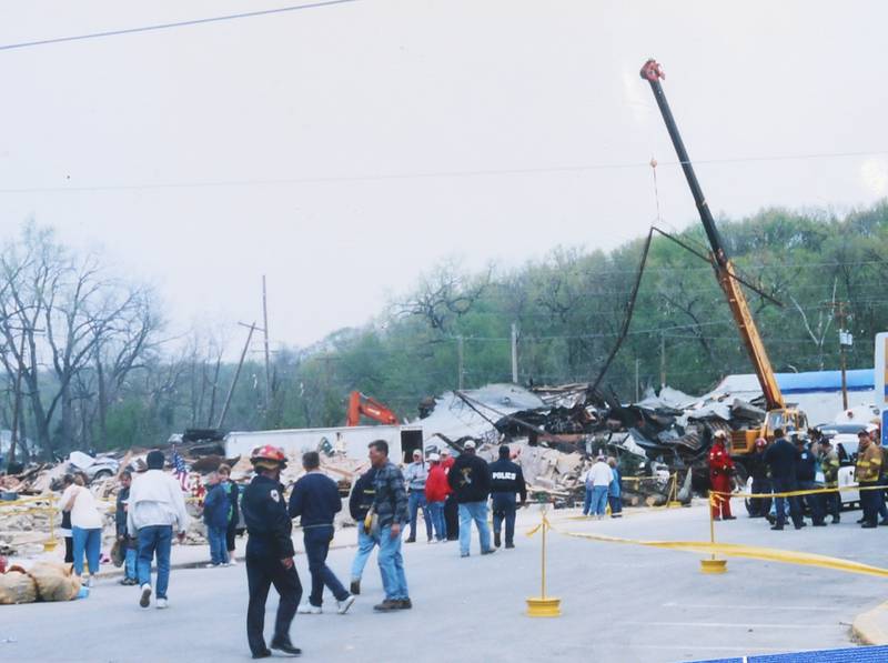 Crews work the scene where the former Milestone Tap stood on Wednesday, April 21, 2004 downtown Utica.