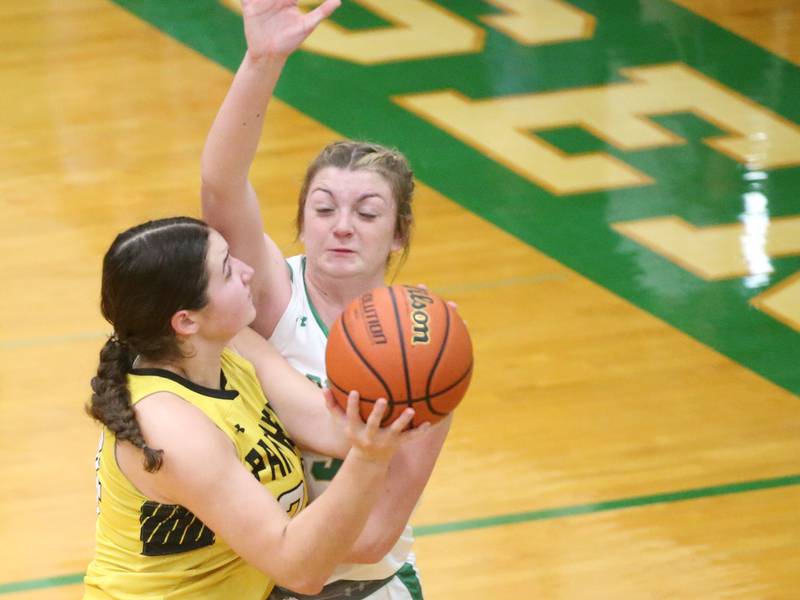 Putnam County's Maggie Richetta eyes the hoop as Seneca's Tessa Krull defends on Thursday, Jan. 4, 2024 at Seneca High School.