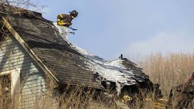 Photos: Investigators continue search for possible Emerson fire victim