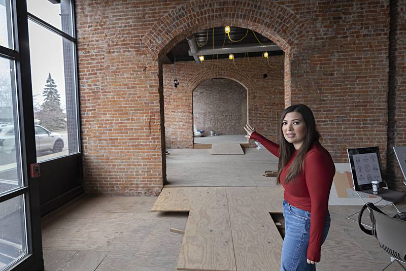 Ashley Nares points out the adjacent cocktail lounge. Next to that will be the bridal suite.