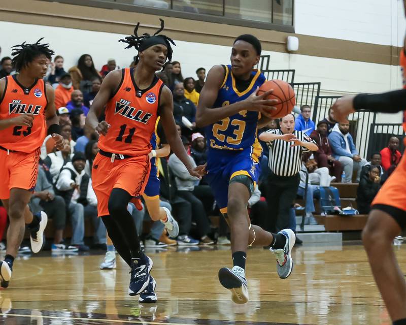 Joliet Central's Danny Thompson (23) drives to the basket in the WJOL Tournament Championship game. Nov 25, 2023.