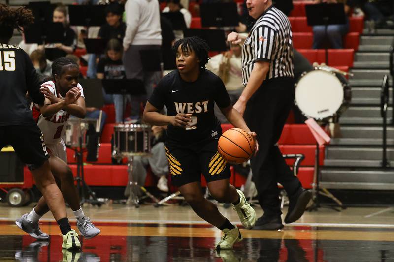 Joliet West’s Khiana Tyler works the ball against Bolingbrook on Thursday, Jan 23, 2025 in Bolingbrook.