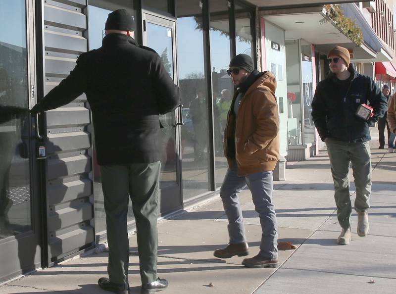 Nick Fox, CL Enterprises Vice President of Construction and Development holds the door open for others at the entrance of the former Maytag building on the corner of First Street and Joliet Streets on Wednesday, Jan. 8, 2025 downtown La Salle. CL Enterprises and La Salle City officials met together for an inspection of the Maytag and Kaskaskia buildings.