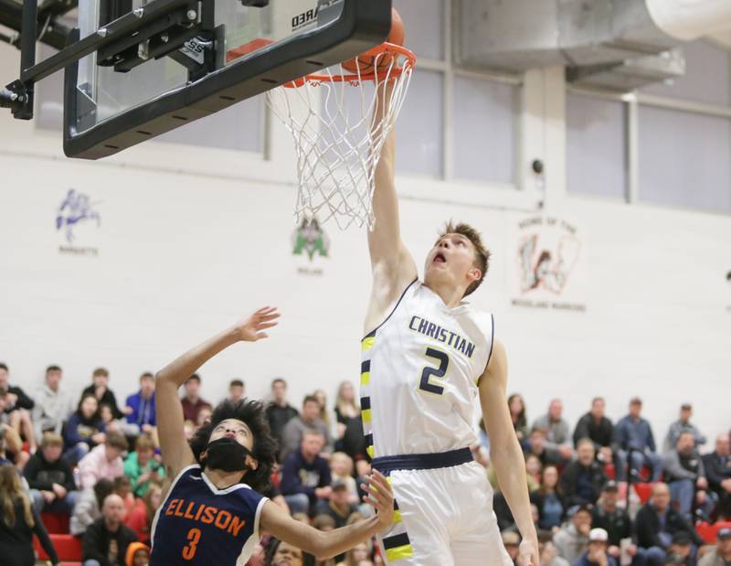 Yorkville Christian's Jaden Schutt (2) slips past Ellison's Amarion Patterson (3) to dunk the ball in the Class 1A sectional semifinal game on Tuesday, March 1, 2022, at Streator Woodland.