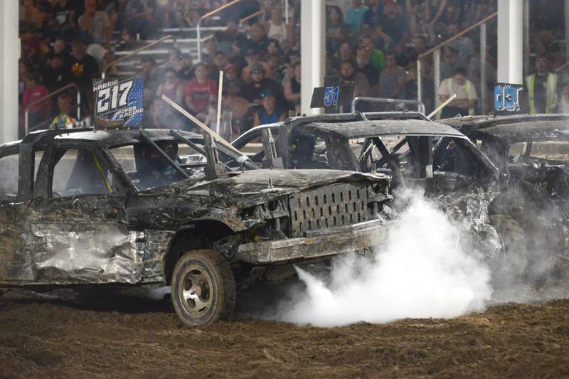 Steam shoots out of a broken radiator hose in Levi Harris' car in the Open Wire  heat at the Whiteside County Fair's demolition derby on Saturday, Aug. 17, 2024.