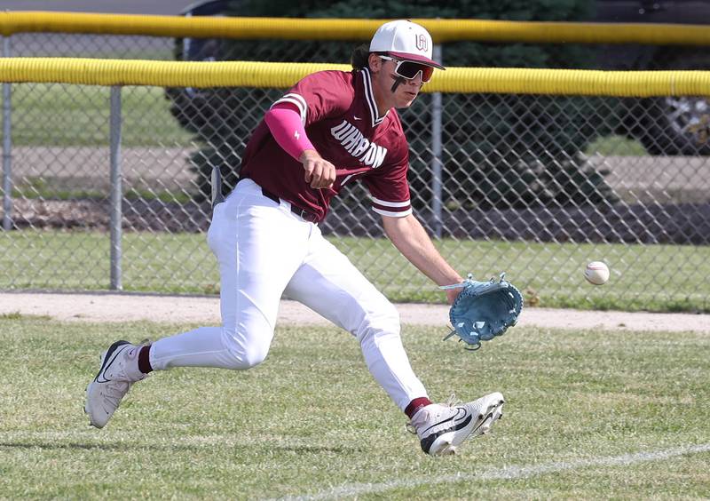 Wheaton Academy's Brandon Kiebles fields a ball in the outfield during their Class 3A sectional semifinal against Sycamore Wednesday, May 29, 2024, at the Sycamore Community Sports Complex.