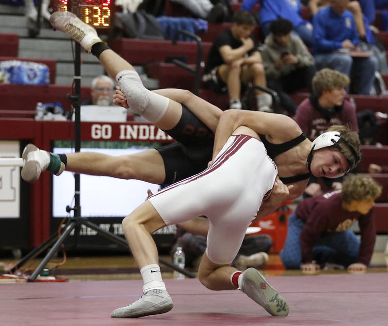 Marengo’s Hayden Beebe is tossed by (Wheaton Academy’s Lincoln Hoger in the 132-pound championship match of the IHSA 1A Marengo Wrestling Regional on Saturday, Feb. 8, 2025, at Marengo High School.