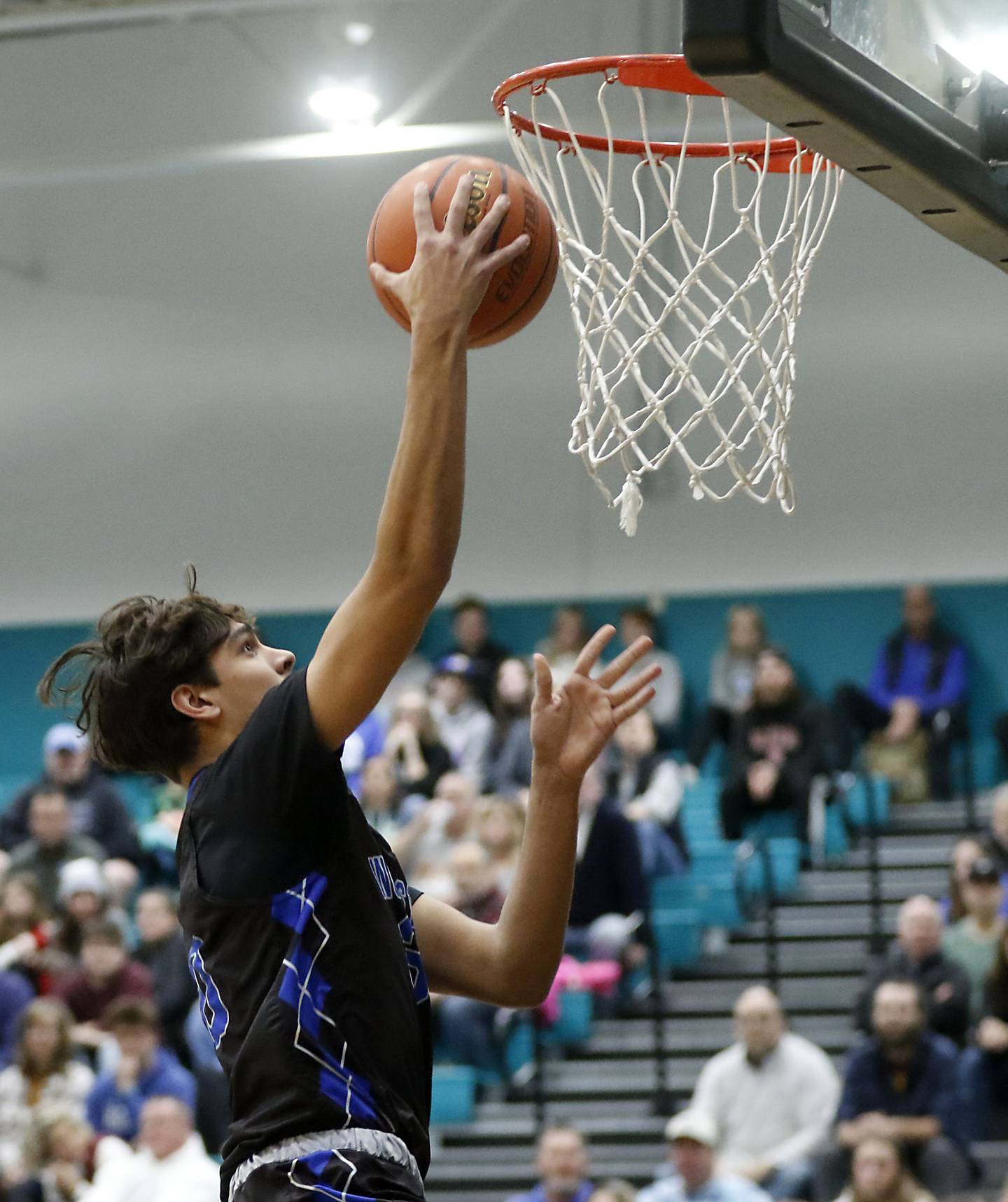 Woodstock's Spencer Cullum drives to the basket during a Kishwaukee River Conference boys basketball game against Woodstock North on Friday, Jan. 5. 2024, at Woodstock North High School.
