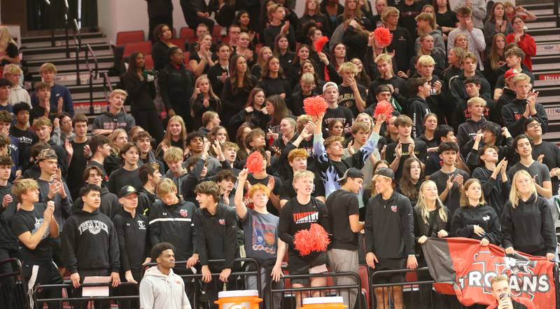 Timothy Christian students cheer on the Trojans as they play Bloomington Central Catholic during the Class 2A State semifinal game on Friday, Nov. 15, 2024 at CEFCU Arena in Normal.