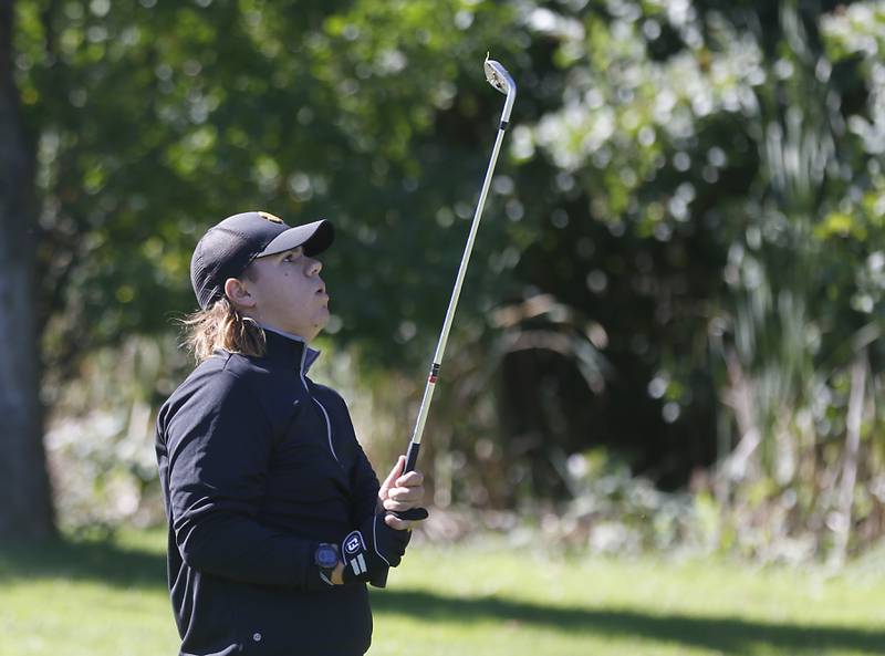 Harvard’s Logan Garafol watches his approach shot on the first hole during the IHSA 2A Marengo Regional Golf Tournament Wednesday, Sept. 28, 2023, at Marengo Ridge Golf Club.