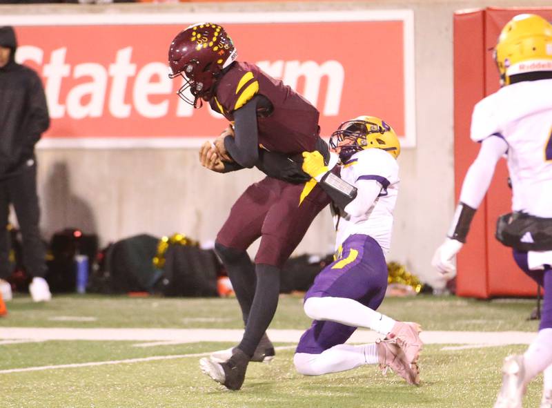 Montini quarterback Israel Abrams is taken down by Monticello's Carter Foran near the goal line but drags him in the endzone to score a touchdown during the Class 3A State football championship on Friday, Nov. 29, 2024 at Hancock Stadium in Normal.