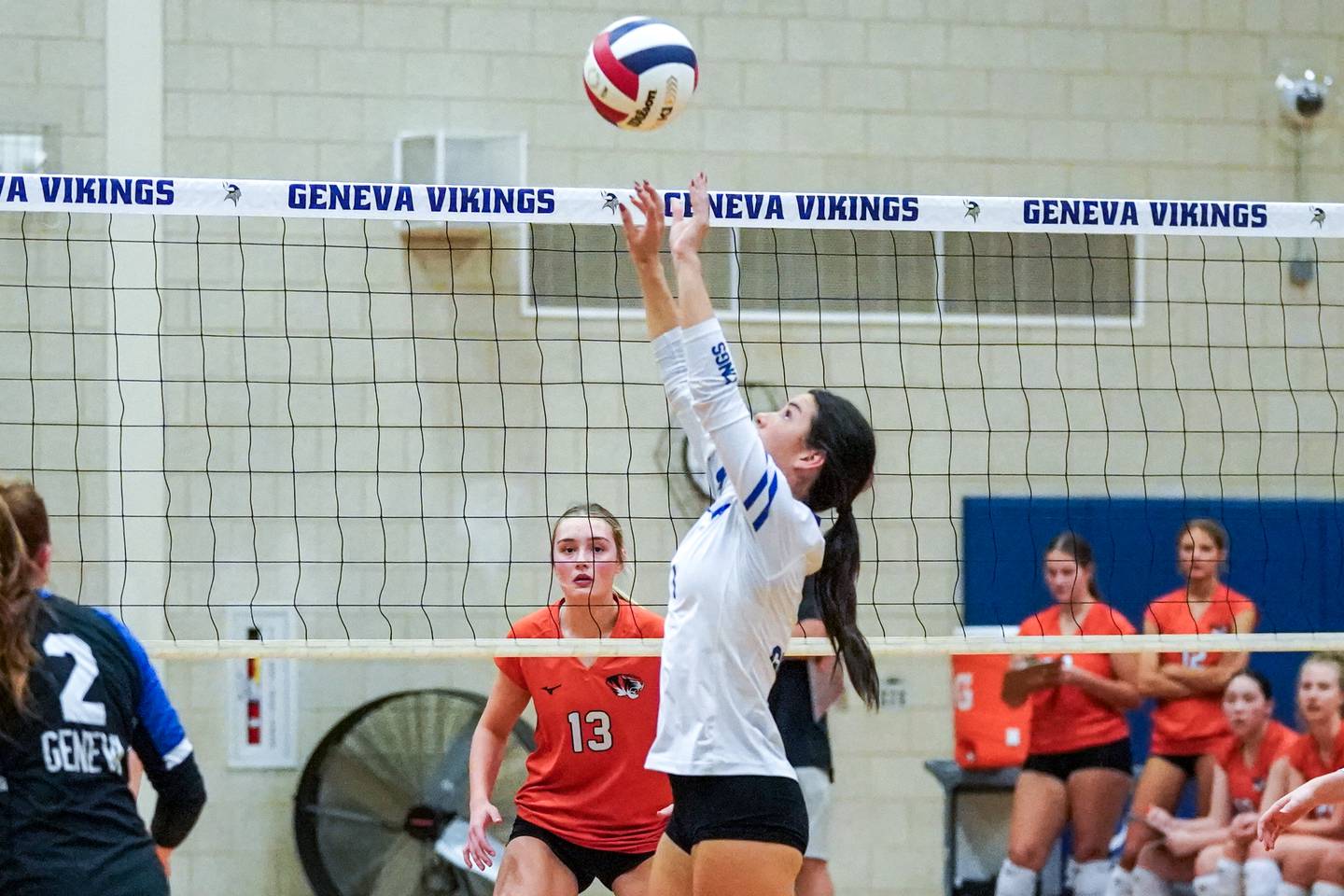 Geneva’s Alyssa Stevenson (1) sets the ball against Wheaton Warrenville South during a DuKane Conference match in Geneva on Tuesday, Sept. 16, 2025.