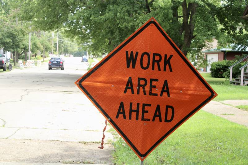A Work Area Ahead sign is erected along West Third Street in Dixon.