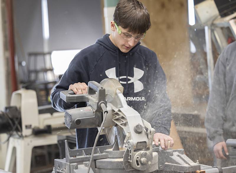 AFC senior John Delhotal runs a saw Thursday, Jan. 15, 2026, in the woodshed at the high school. The Ag program recently won a $4,500 grant, which will help add more equipment to the shop at the high school.