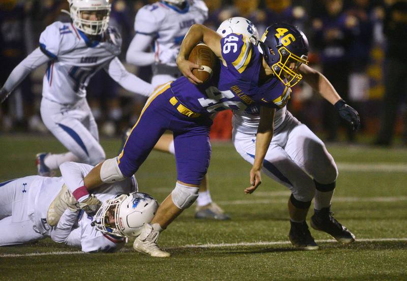 Wauconda's Cole Porten (46) fights the Lakes' defense to gain extra yards during Friday’s football game in Wauconda.