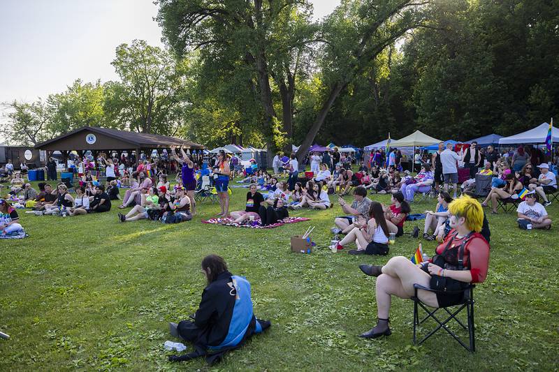 Sauk Valley Pride Fest attendees listen to a band Saturday, June 14, 2025, at Page Park in Dixon.