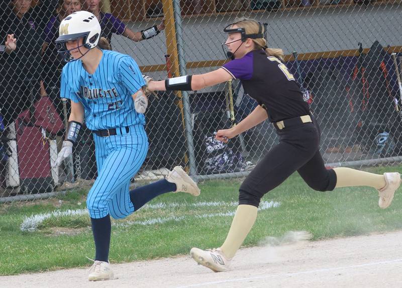 Serena's Anna Hjerpe tags out Marquette's Taylor Gamons in a rundown between home plate and third base during the Class 1A Regional title game on Friday, May 22, 2026 at Serena High School.