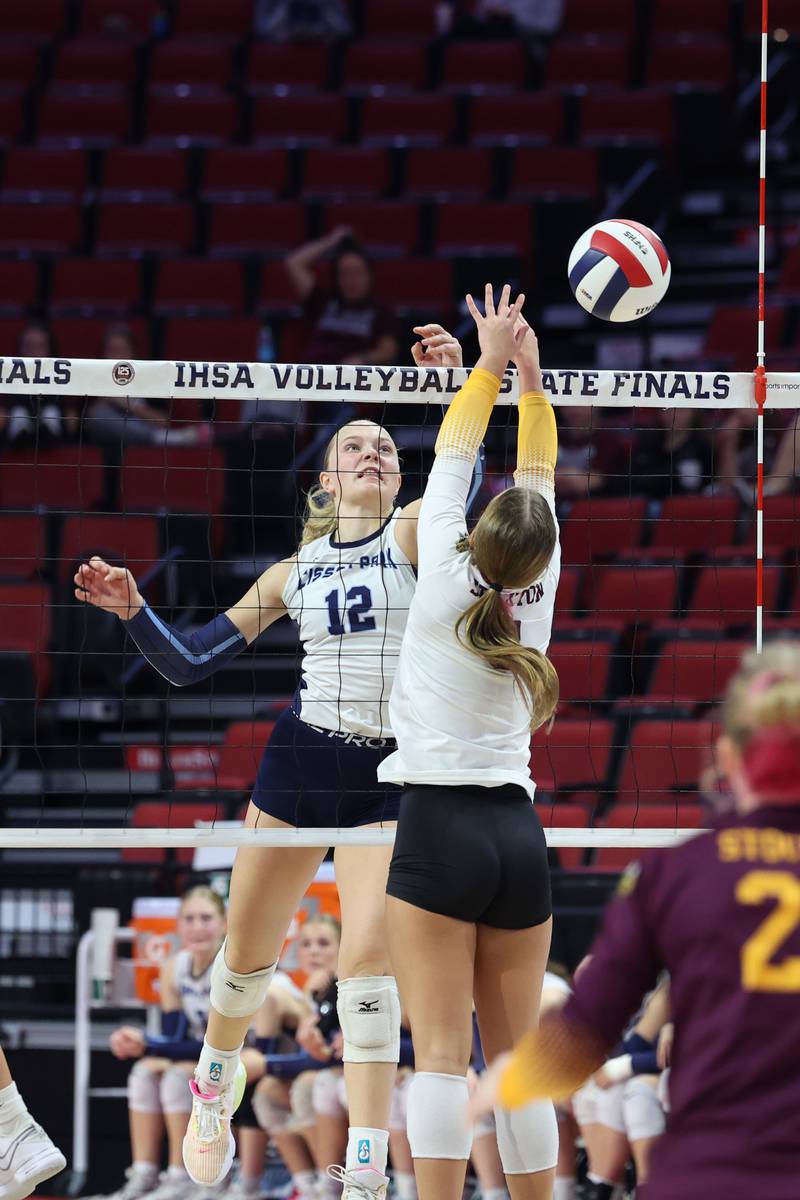 Cissna Park's Josie Neukomm tips the ball over the net during the Timberwolves' victory in two sets, 25-11, 25-14, over Stockton in the IHSA Class 1A State championship on Saturday, Nov. 15, 2025.