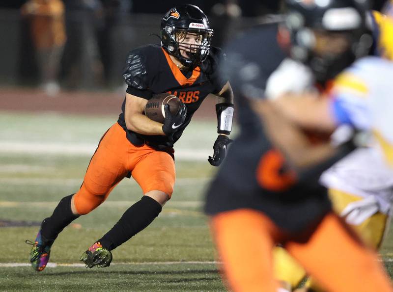 DeKalb's Talen Tate follows his blockers during their game against Sandburg Friday, Sept. 8, 2023, at DeKalb High School.