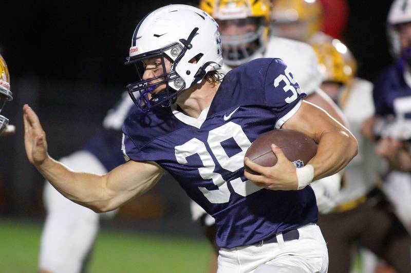 Cary-Grove’s Holden Boone runs the ball against Jacobs in varsity football on Friday, Sept. 20, 2024, at Al Bohrer Field on the campus of Cary-Grove High School in Cary.