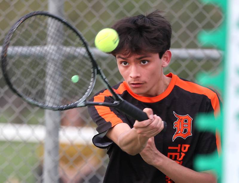 DeKalb number two singles player Jahan Islam keeps his eye on the ball Thursday, April 24, 2025, during their match at Sycamore High School.