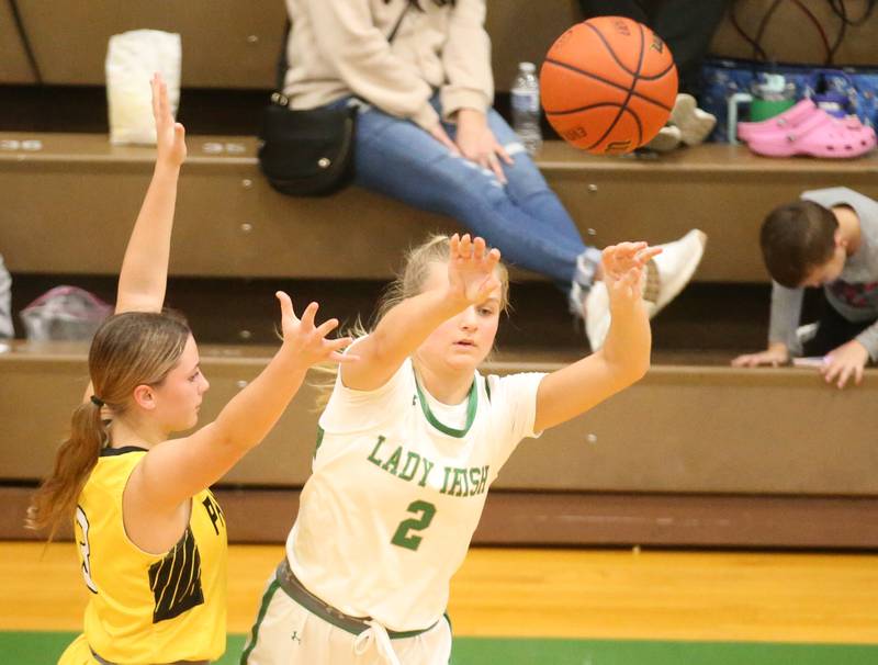 Seneca's Lainie Olson passes the ball as Putnam County's Gabby Doyle defends on Thursday, Jan. 4, 2024 at Seneca High School.