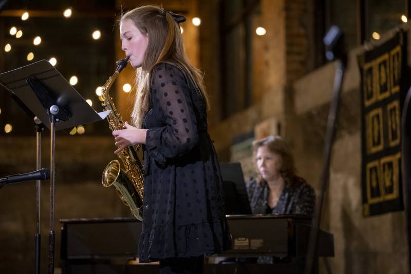 Ella Lewis of Mendota High School plays "Tableaux de Provence" on the saxophone for the audience at the Mad Hatter Ball on January 17, 2024 at the Westclox Event Center.