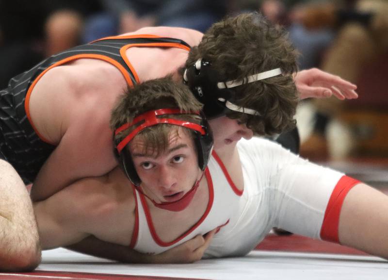Huntley’s Waylon Theobald, bottom, battles Crystal Lake Central’s Tyler Porter at 175 pounds in varsity wrestling on Friday, Dec. 13, 2024 at Huntley High School in Huntley.