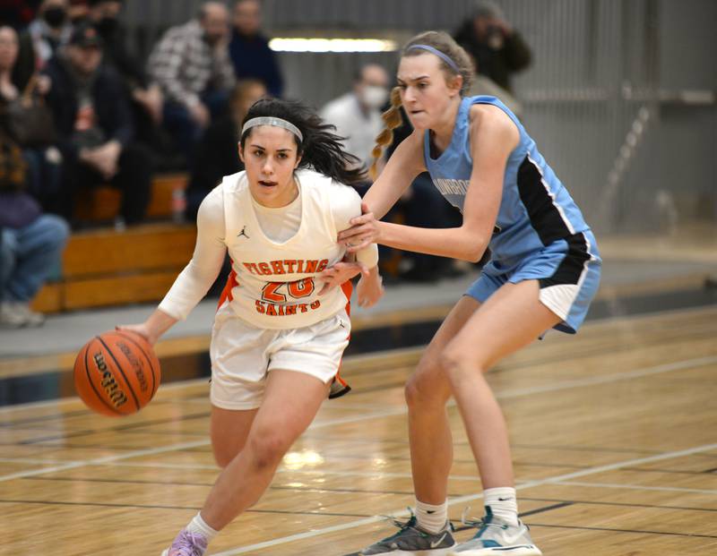 St. Charles East's Alexis Maridis makes her way down court during their regional game against Willowbrook Thursday Feb. 17, 2022.
