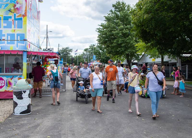 Patrons attend the DuPage County Fair at the DuPage Event Center & Fairgrounds on Saturday, July 30, 2022.