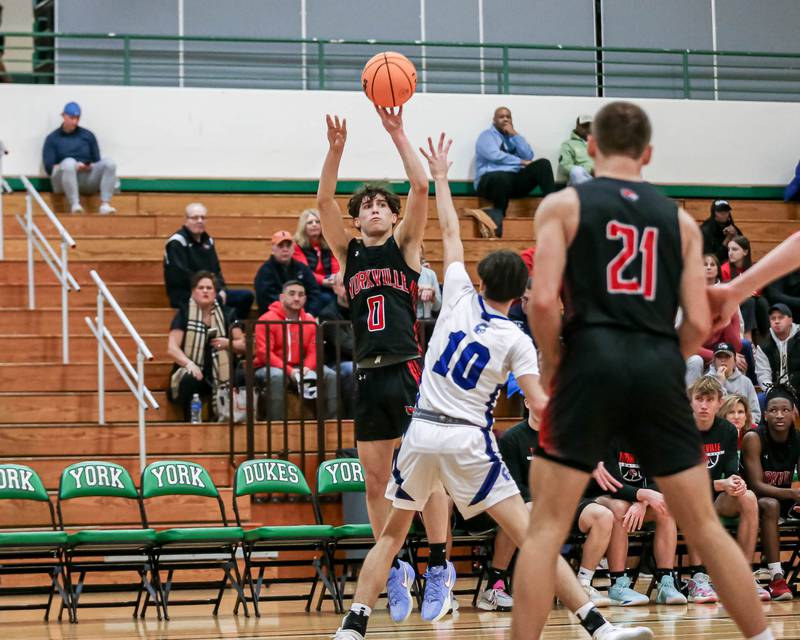 Yorkville's Gabe Sanders (0) shoots a jumper during their Jack Tosh Holiday Classic basketball tournament game between St Francis at Yorkville Thursday Dec 26, 2024 in Elmhurst.