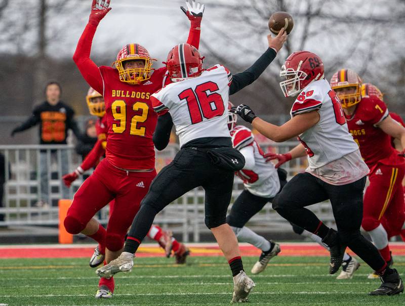 Batavia’s Quinn Ahrens (92) defends against a pass attempt by Yorkville's Michael Dopart (16) during a 7A quarterfinal playoff football game at Batavia High School on Saturday, Nov 12, 2022.